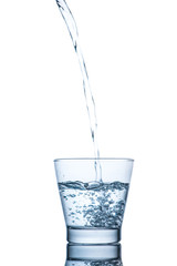 Drinking water is poured into a glass