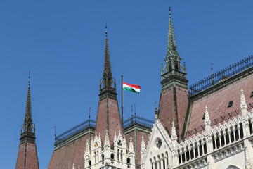 Obraz premium Hungary flag on the Hungarian Parliament Building, Budapest
