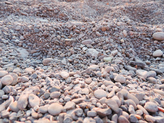 Pebble beach, stone beach with selective focus.