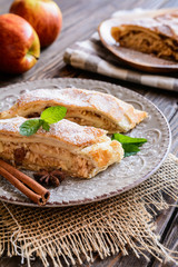 Traditional puff pastry strudel with apple and raisins filling