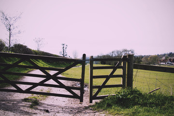 Wooden gate across a path in the countryside Vintage Retro Filte