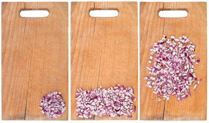 Sliced onion rings on a cutting board. Isolated on white.