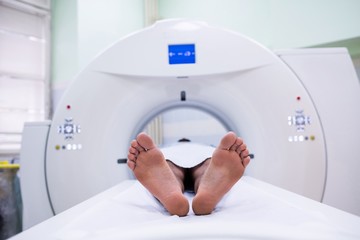 Patient lying on mri machine