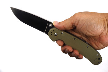 folding knife in hand with white background.