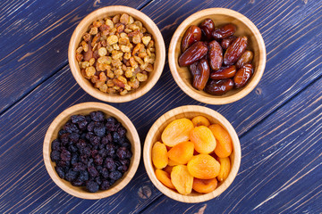Dried fruits assortment on wooden background. Top view