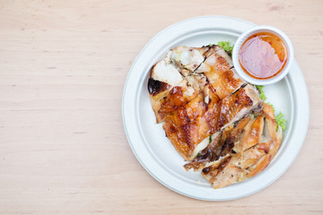 Grilled chicken on wooden background