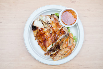 Grilled chicken on wooden background