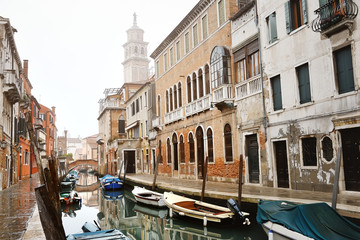 Fototapeta na wymiar Venetian canal with buildings and boats, Venice, Italy