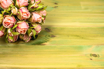 Fototapeta na wymiar Valentines day roses, bouquet on wooden background