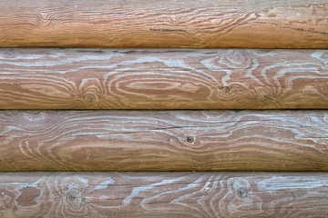Natural wooden background from parallel wooden logs