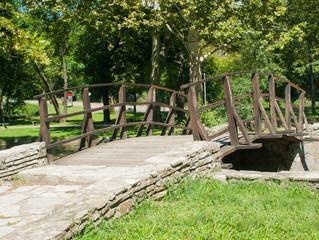 The wooden bridge over the lake at the park