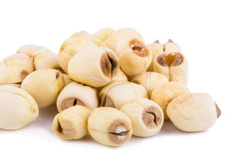 Dried lotus seeds on white background