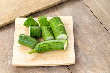 Snake gourd on wooden background