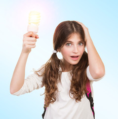 Shocked schoolgirl with lamp