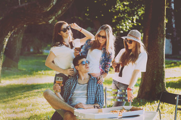 Obraz na płótnie Canvas Сheerful friends on picnic