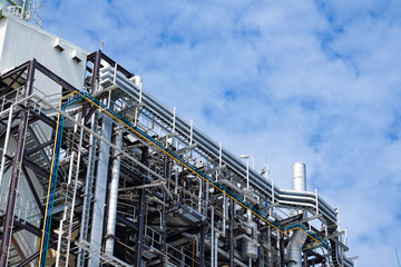 Top floor of boiler or HRSG of combine cycle power plant against blue sky