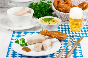 Bavarian sausage with pretzel, sweet mustard and beer