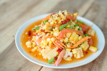 Selective focus Som Tum - papaya salad with corn - spicy Thai food