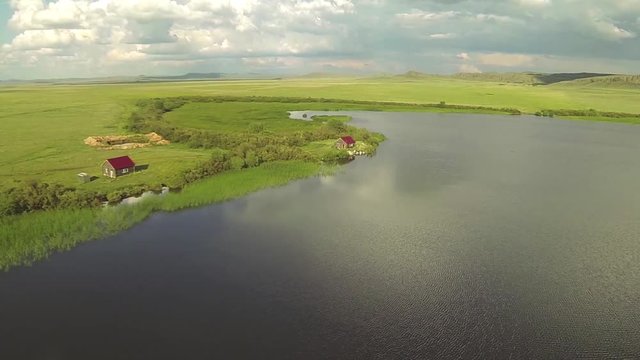 Aerial view of two house in the lake coast, Kazakhstan