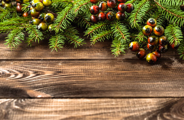 Green christmas tree on wooden background