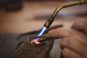 Goldsmith crafting ring by burner