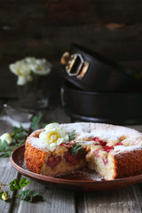 Homemade strawberry pie on a wooden background