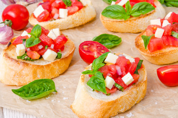 Bruschetta with tomato, onion, cheese and fresh basil