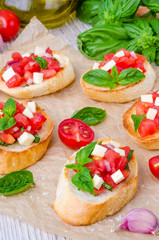Bruschetta with tomato, onion, cheese and fresh basil