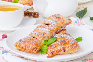 Pies from puff pastry with cherry