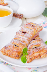 Pies from puff pastry with cherry