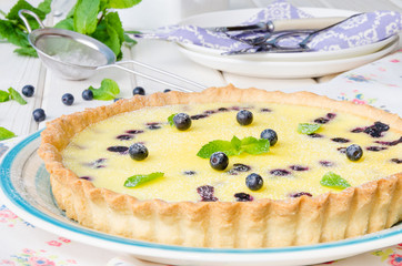 Tart with blueberries in cream filling