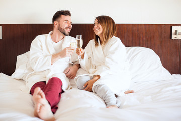 Honeymooners celebrating in a hotel