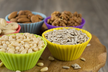 Nuts in cupcake's molds. Shallow depth of field