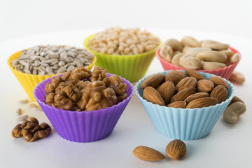 Nuts in cupcake's molds. Shallow depth of field