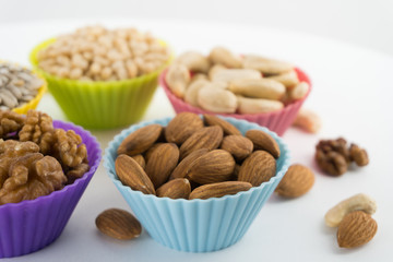 Nuts in cupcake's molds. Shallow depth of field