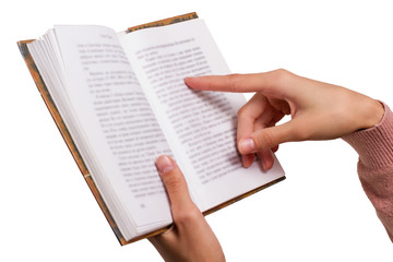 Isolated Female Hands holding a Vintage Book, pointing on a Word