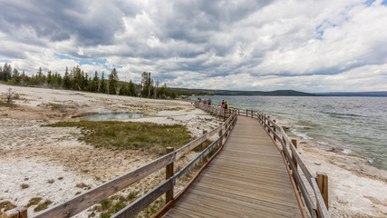 Beautiful clouds over the Yellowstone Lake, the largest lake at high elevation in North America. West Thumb Geyser Basin, Yellowstone National Park, Wyoming