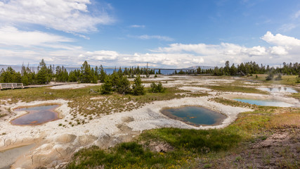 Thumb Paint Pots were originally known as Mud Puffs. Water here is much more acidic and dissolves the rock into clay. West Thumb Geyser Basin, Yellowstone National Park, Wyoming