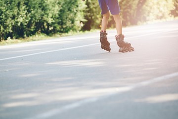 Happy child rollerblading on a sunny day