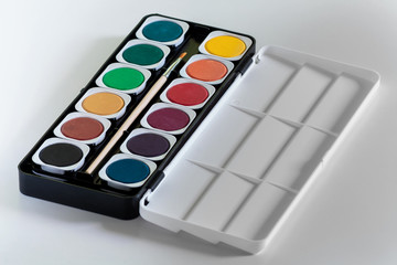 Watercolor palette on white background .
