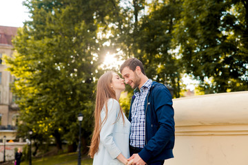 Sweet young couple is standing and posing together