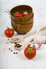 Vegetables and spices in wooden bowls