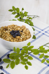 Granola with  blueberry on a wooden table
