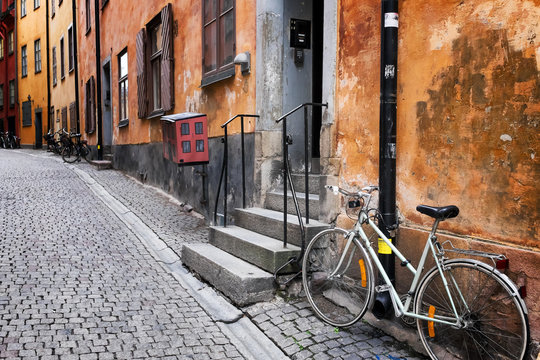 Sweden Stockholm quaint cobblestone street in historic district Gamla Stan. Parked bike