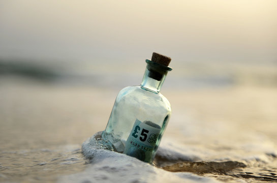 five pound in a bottle at sea