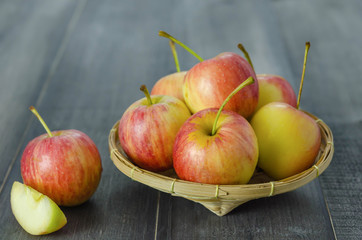 Red and yellow apple   on wooden background
