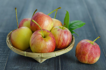 Red and yellow apple   on wooden background