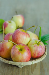 Red and yellow apple   on wooden background