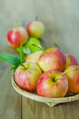 Red and yellow apple   on wooden background