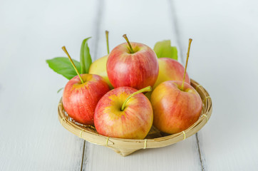Red and yellow apple   on wooden background